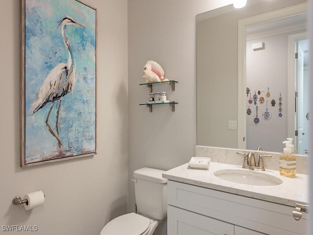 bathroom with vanity and toilet