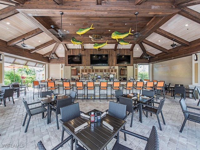 view of patio / terrace featuring a gazebo, a bar, and ceiling fan