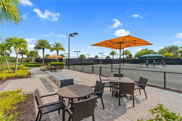 view of patio / terrace featuring tennis court