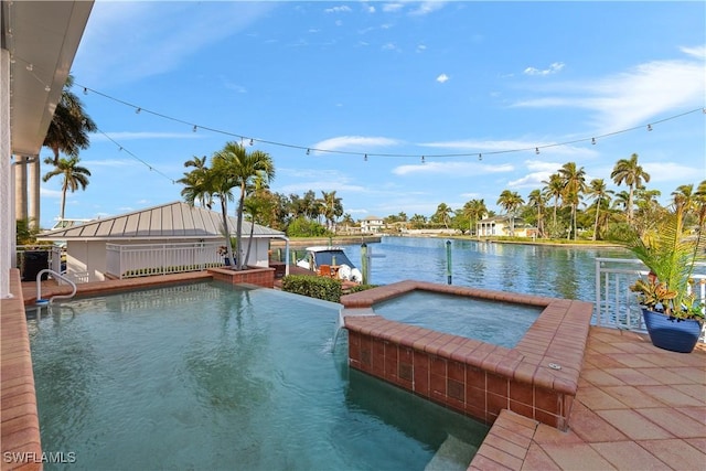 view of dock with a swimming pool with hot tub, a water view, and a patio area