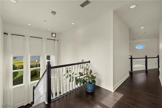 hallway featuring dark hardwood / wood-style flooring