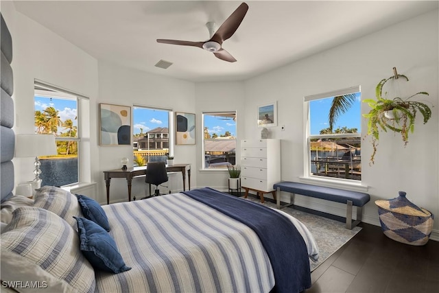 bedroom with hardwood / wood-style flooring and ceiling fan