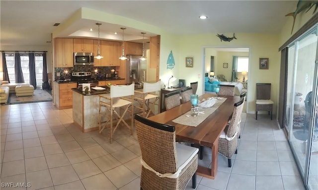 dining area featuring light tile patterned floors