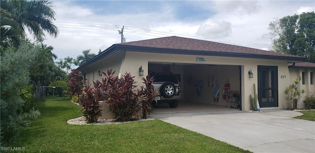 view of side of property featuring a garage and a lawn