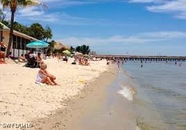 property view of water featuring a beach view