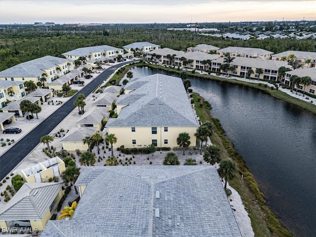 aerial view at dusk with a water view