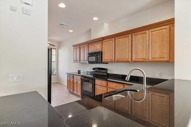 kitchen with ceiling fan, sink, light tile patterned floors, and black appliances