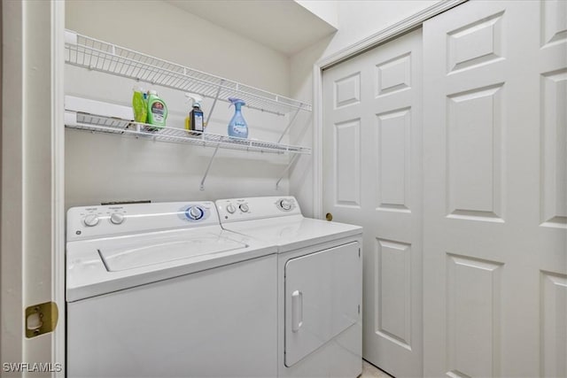 laundry room featuring washer and clothes dryer