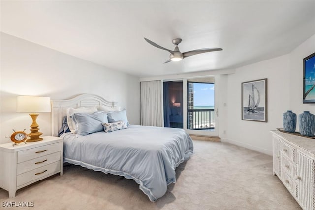 bedroom featuring baseboards, access to outside, a ceiling fan, and light colored carpet