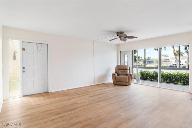 unfurnished room with ceiling fan and light hardwood / wood-style flooring