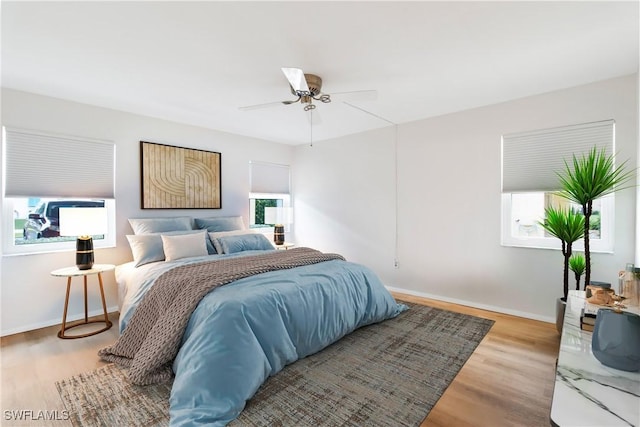 bedroom featuring wood-type flooring and ceiling fan