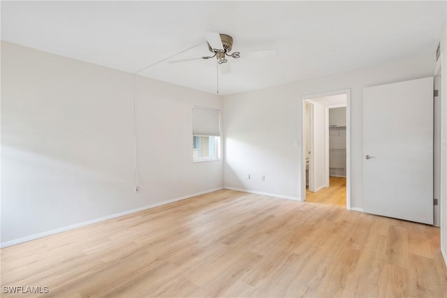 unfurnished room featuring light hardwood / wood-style floors and ceiling fan