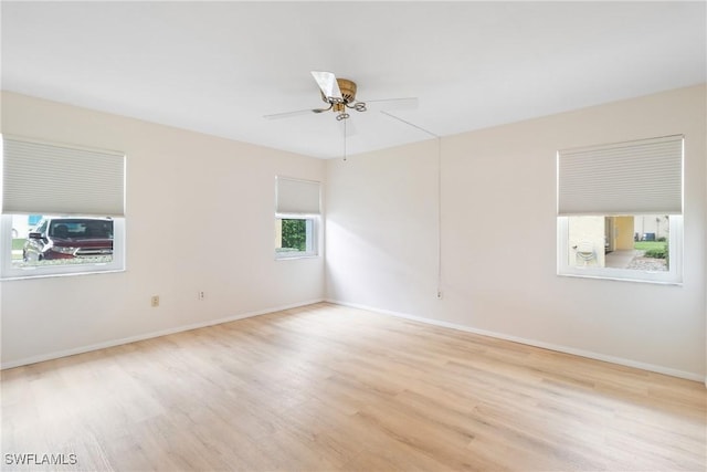 unfurnished room featuring ceiling fan and light hardwood / wood-style flooring