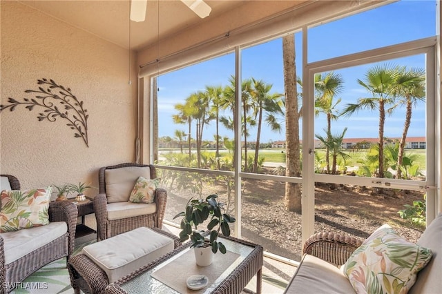 sunroom with ceiling fan