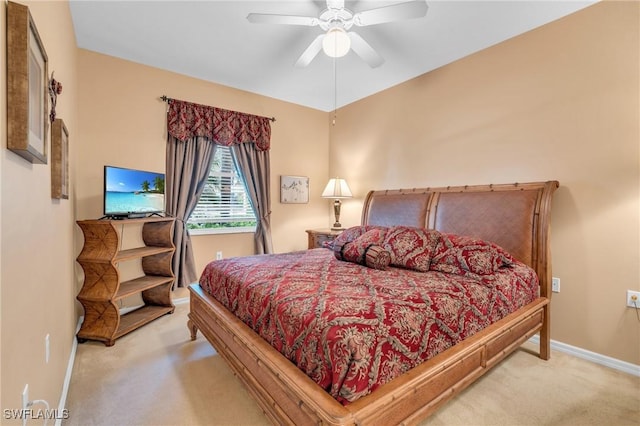 bedroom with light colored carpet and ceiling fan