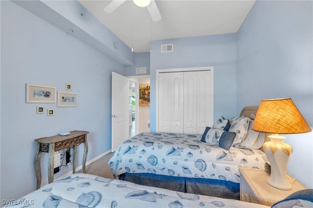 bedroom with ceiling fan, a closet, and carpet floors