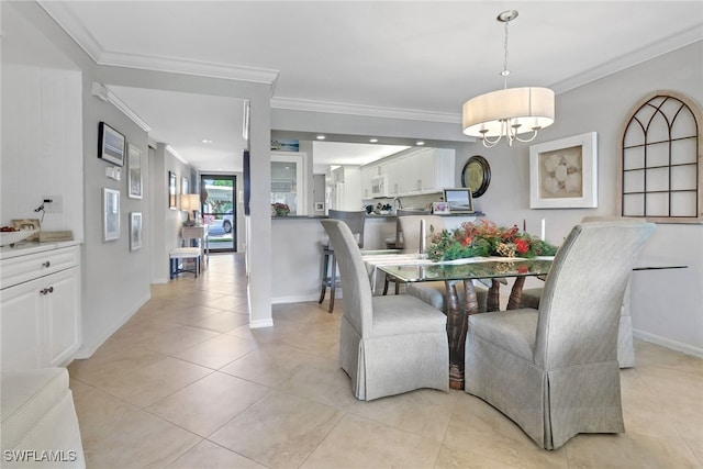 tiled dining space featuring an inviting chandelier and ornamental molding