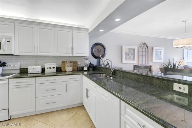 kitchen with white cabinetry, sink, dark stone countertops, white appliances, and light tile patterned floors