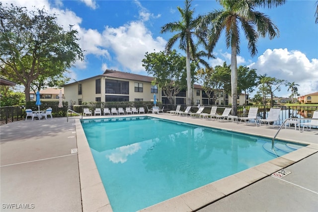 view of swimming pool with a patio