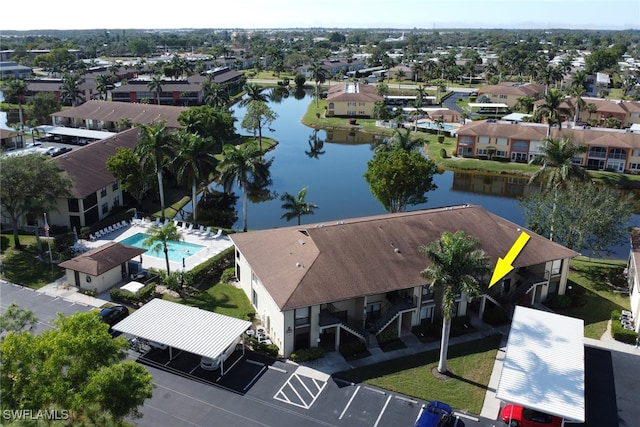 birds eye view of property featuring a water view