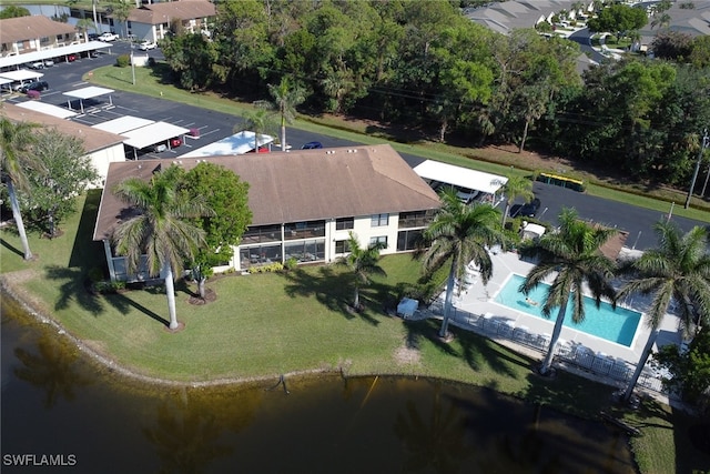 birds eye view of property featuring a water view