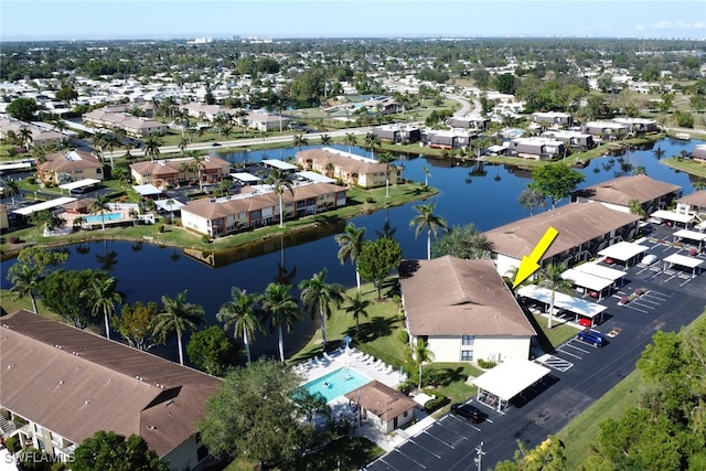 birds eye view of property featuring a water view