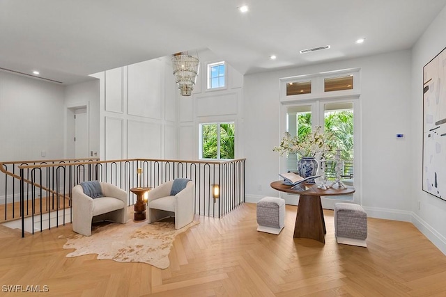 living area featuring light parquet floors