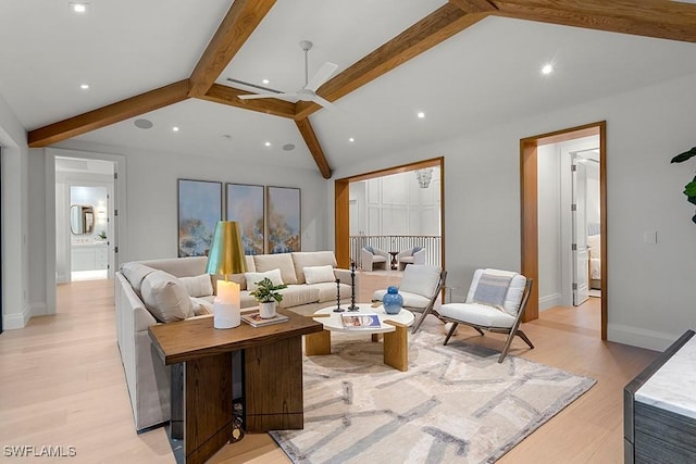 living room with lofted ceiling with beams, ceiling fan, and light hardwood / wood-style flooring