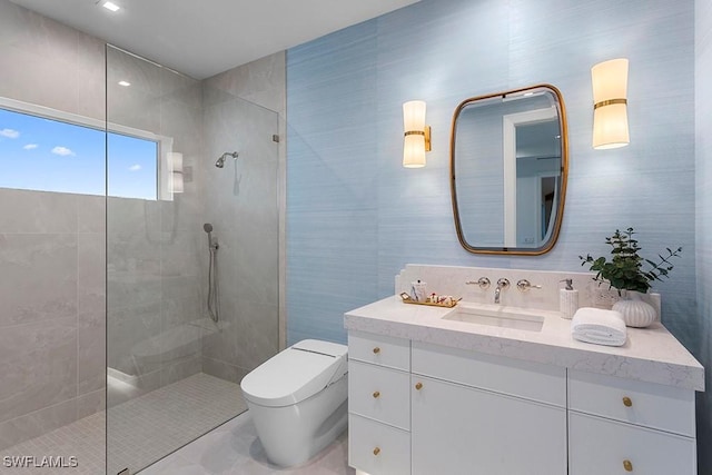 bathroom with toilet, vanity, and walk in shower