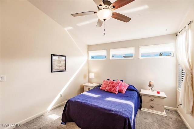 bedroom with light carpet, ceiling fan, and lofted ceiling