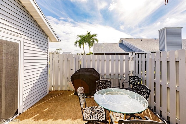 view of patio featuring a grill