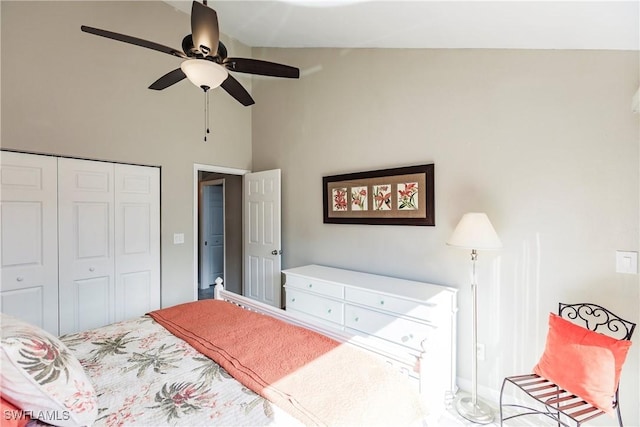 bedroom featuring ceiling fan, a closet, and vaulted ceiling