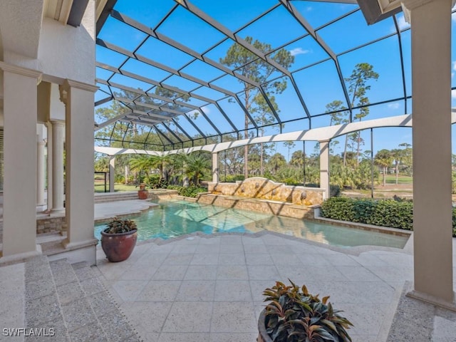 outdoor pool with glass enclosure and a patio