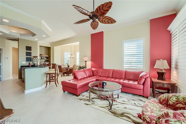 living room with a ceiling fan, light tile patterned flooring, and crown molding