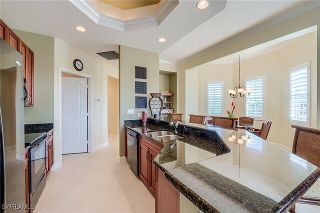 kitchen featuring recessed lighting, an inviting chandelier, ornamental molding, a sink, and black appliances