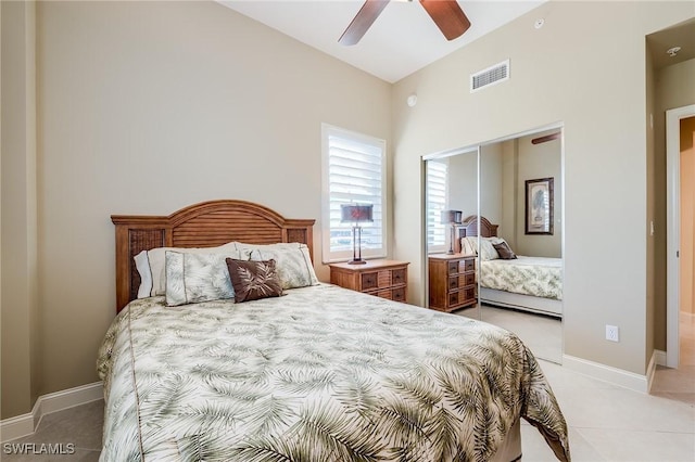 bedroom featuring ceiling fan, light colored carpet, and lofted ceiling