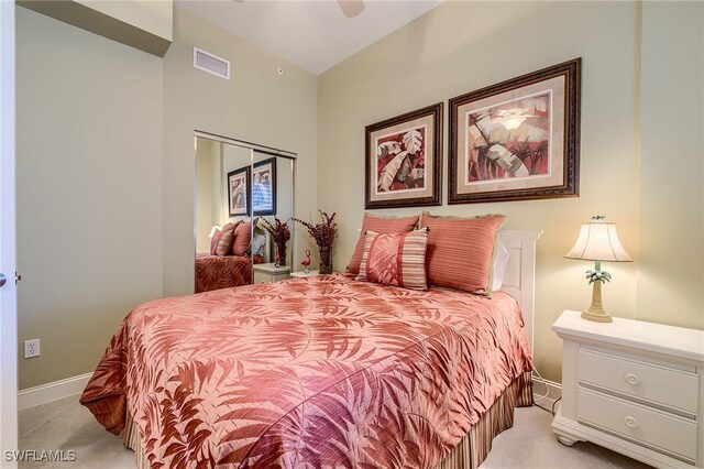 bedroom featuring visible vents, baseboards, and light tile patterned floors