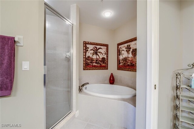 bathroom featuring tile patterned flooring and plus walk in shower