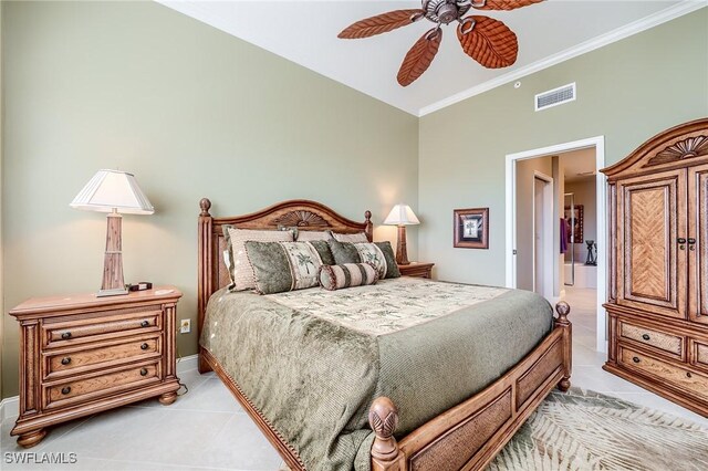 bedroom featuring ceiling fan, light tile patterned flooring, crown molding, and vaulted ceiling