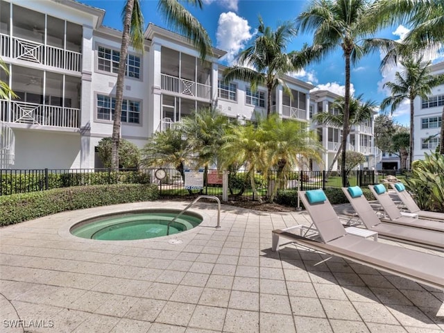 view of pool featuring a hot tub