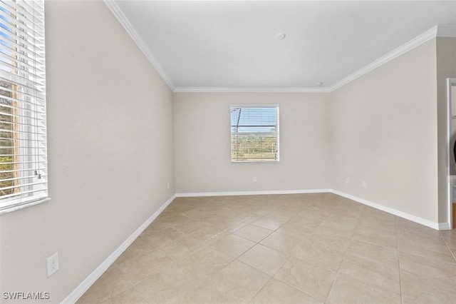 empty room with light tile patterned flooring and ornamental molding