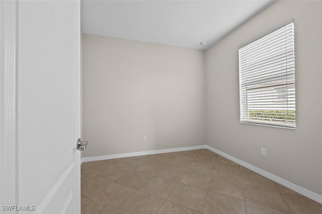 empty room with light tile patterned floors