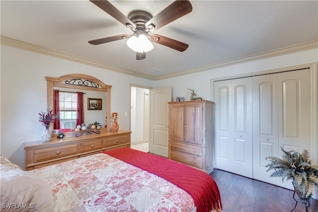 bedroom with ceiling fan, dark hardwood / wood-style floors, ornamental molding, and a closet