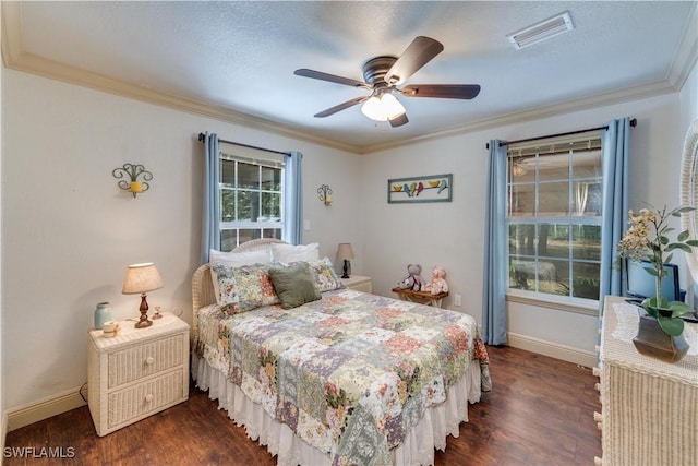 bedroom featuring ceiling fan, dark hardwood / wood-style flooring, ornamental molding, and a textured ceiling