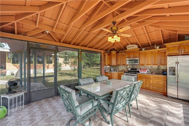 sunroom / solarium featuring vaulted ceiling and ceiling fan