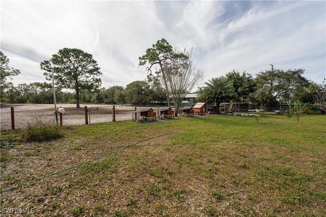 view of yard with a rural view