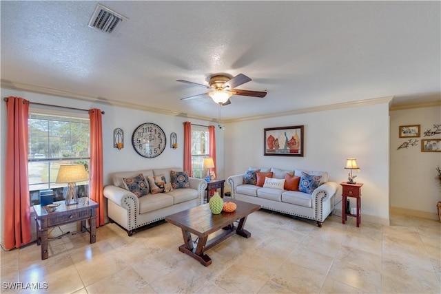 living room with a textured ceiling, ceiling fan, and ornamental molding