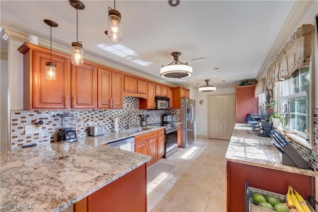 kitchen featuring pendant lighting, crown molding, light stone countertops, appliances with stainless steel finishes, and kitchen peninsula