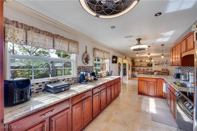 kitchen with sink, tasteful backsplash, pendant lighting, stainless steel range with electric stovetop, and ornamental molding