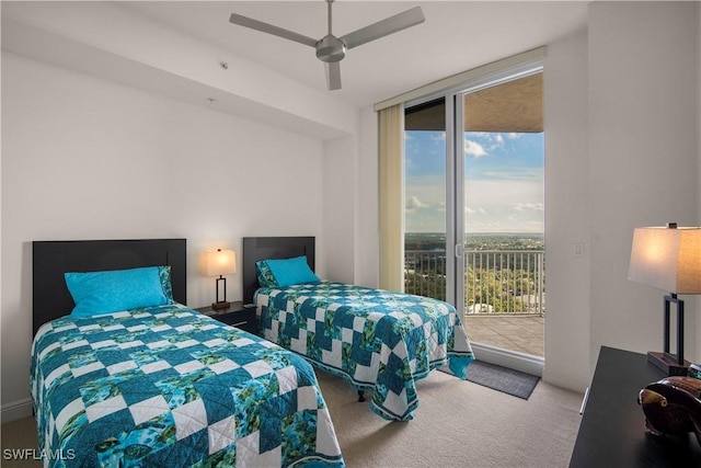 carpeted bedroom with a wall of windows, access to outside, and ceiling fan